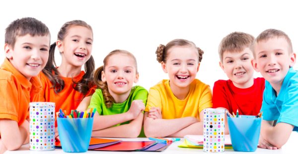 Group of children sitting at a table.